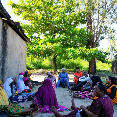 LHRC Officer (in orange clothing) documenting success from women who benefited from Ward Women councilors empowerment programs in Mafia, Pwani region, 2023.